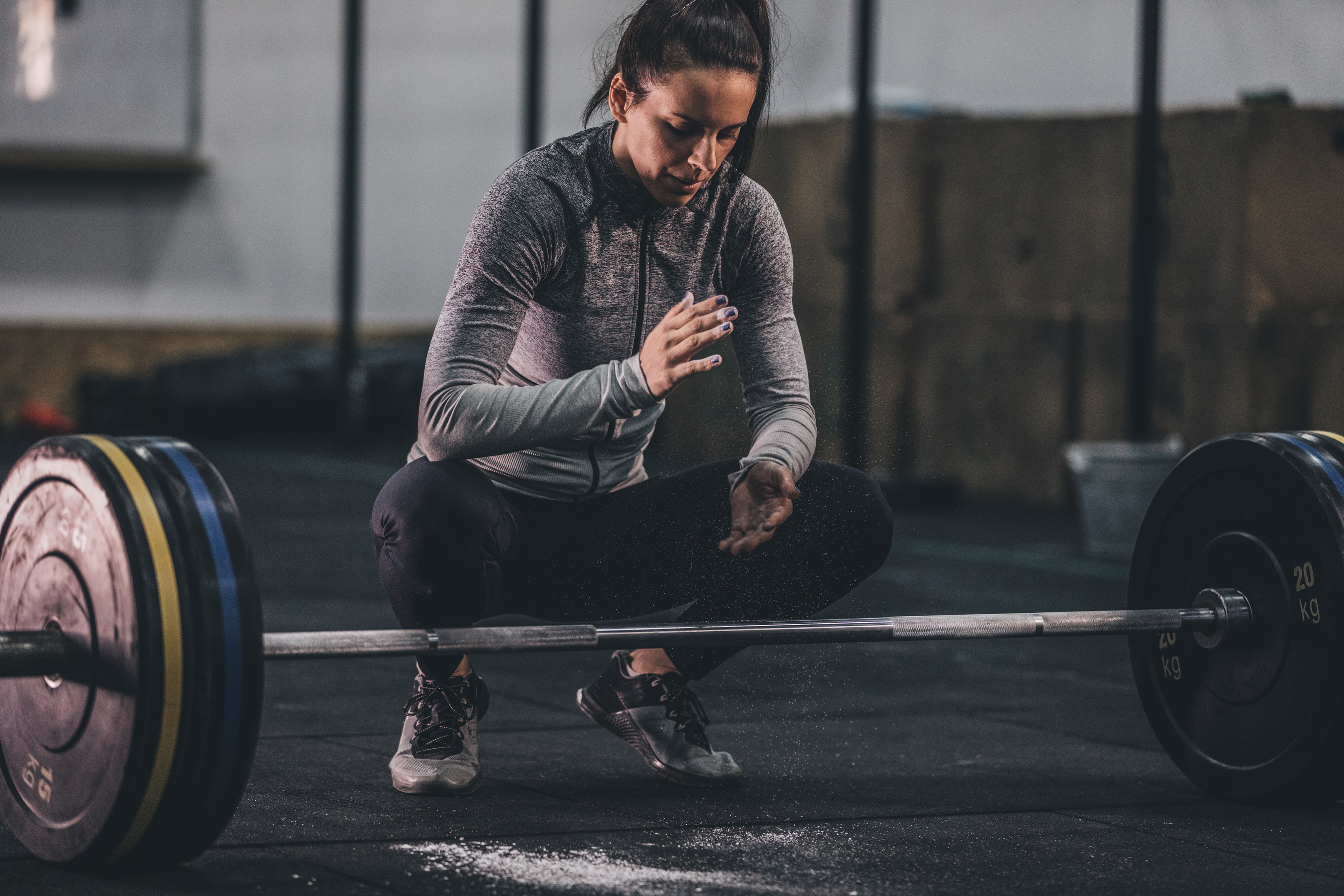 Woman getting ready for deadlifting